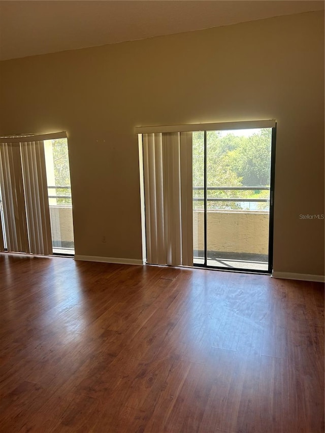 unfurnished room featuring hardwood / wood-style floors