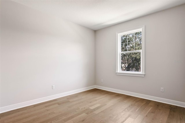 unfurnished room featuring light hardwood / wood-style floors