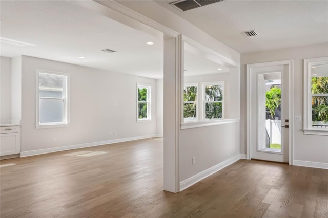 doorway with dark wood-type flooring