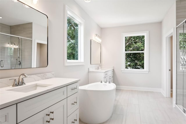 bathroom with independent shower and bath and vanity