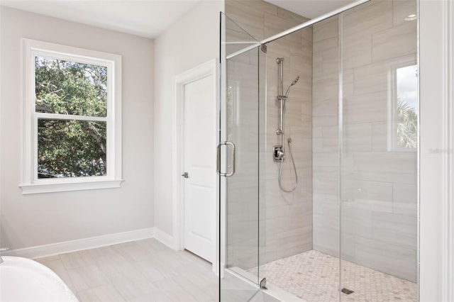 bathroom with tile patterned floors and walk in shower