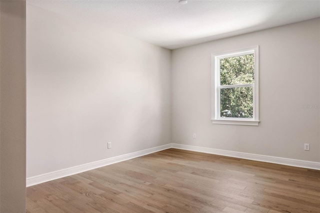 unfurnished room with light hardwood / wood-style flooring