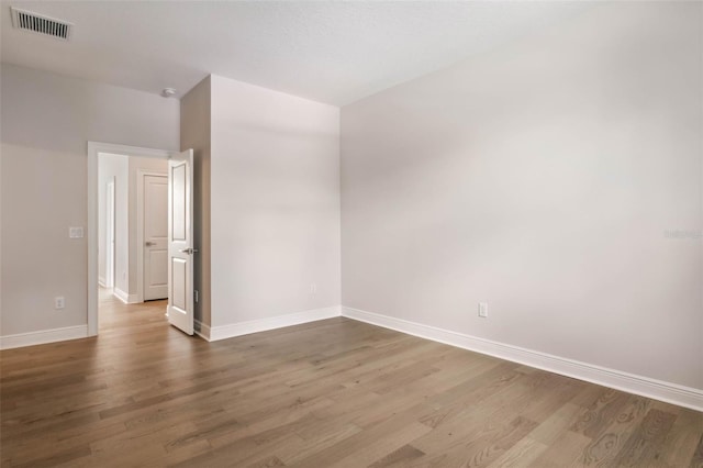 empty room featuring hardwood / wood-style flooring