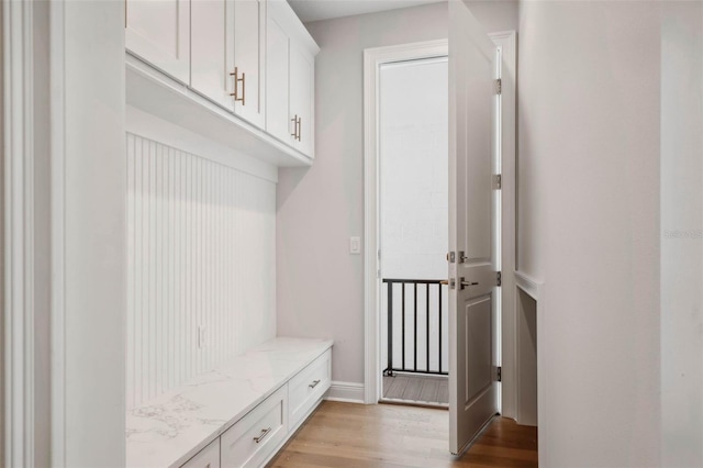 mudroom with light hardwood / wood-style flooring