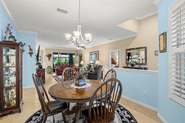 dining area with ornamental molding, ceiling fan with notable chandelier, and light tile patterned floors