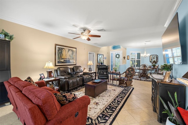 tiled living room featuring crown molding and ceiling fan with notable chandelier