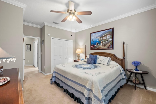 bedroom with ornamental molding, light colored carpet, a closet, and ceiling fan