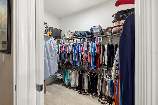 walk in closet featuring hardwood / wood-style flooring