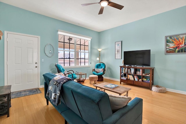 living room with ceiling fan and wood-type flooring