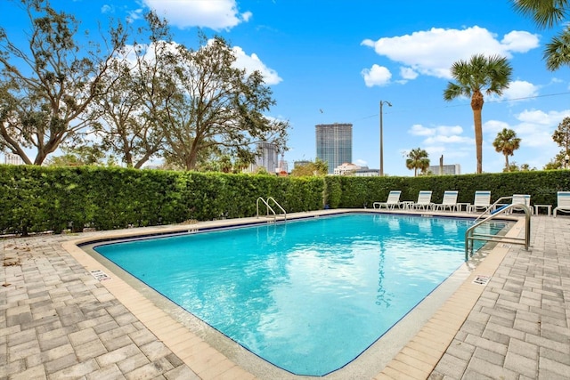 view of pool featuring a patio area