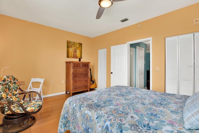 bedroom with wood-type flooring and ceiling fan