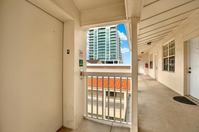 property entrance featuring a balcony and elevator