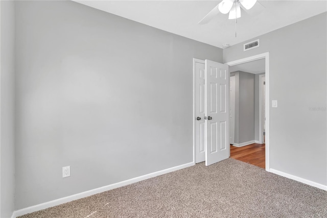 unfurnished room with carpet floors and ceiling fan