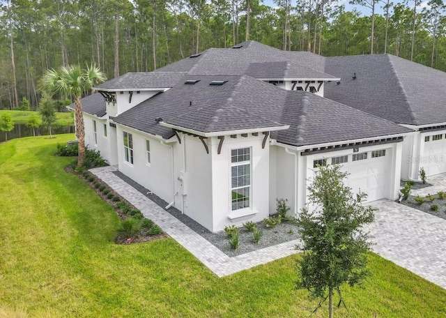 view of front of house with a front lawn and a garage