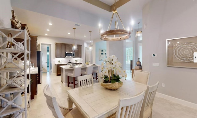 dining room featuring an inviting chandelier and light tile patterned floors