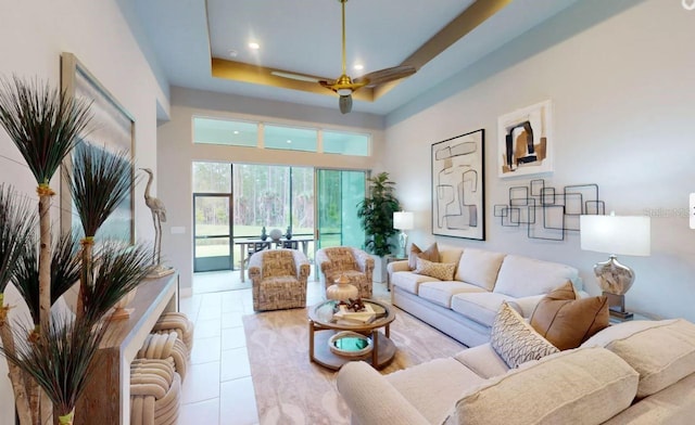 living room featuring light tile patterned flooring and a raised ceiling