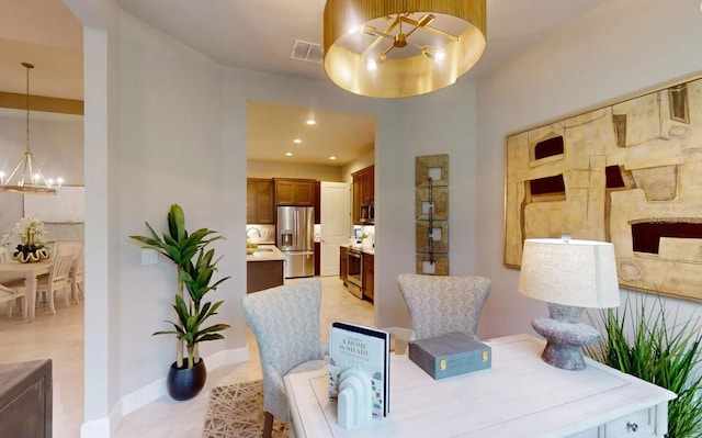 dining space with a chandelier