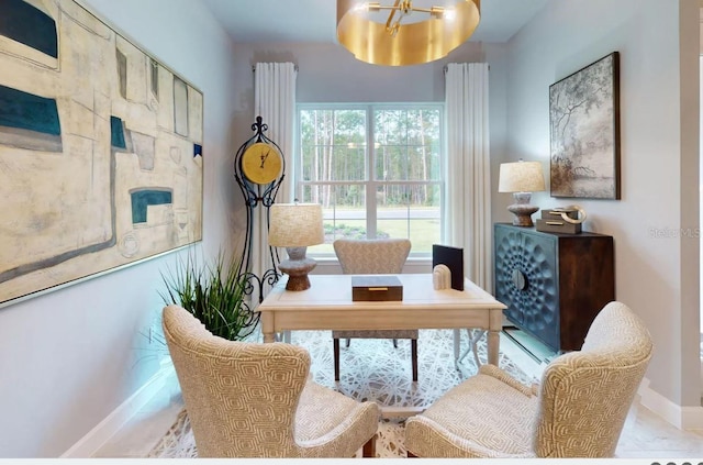 sitting room featuring a chandelier