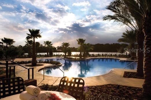 view of pool featuring a patio