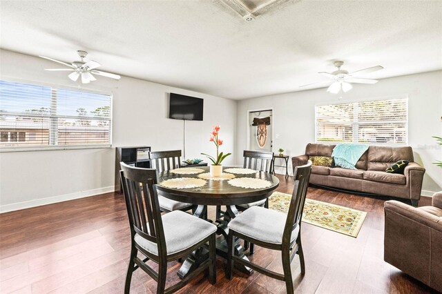 dining area with dark hardwood / wood-style floors, plenty of natural light, and ceiling fan