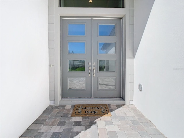 view of exterior entry featuring french doors