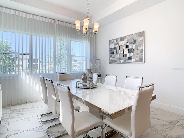 dining space featuring a chandelier