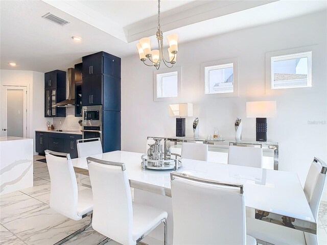 dining area with a notable chandelier