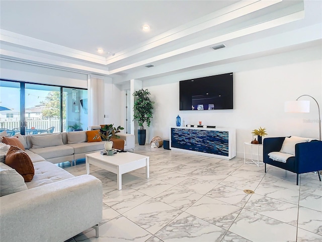 living room featuring a tray ceiling