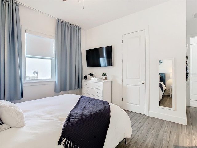 bedroom with light hardwood / wood-style flooring