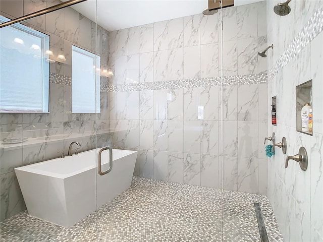 bathroom featuring tile walls and shower with separate bathtub