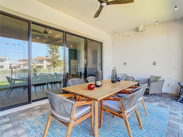 view of patio featuring ceiling fan