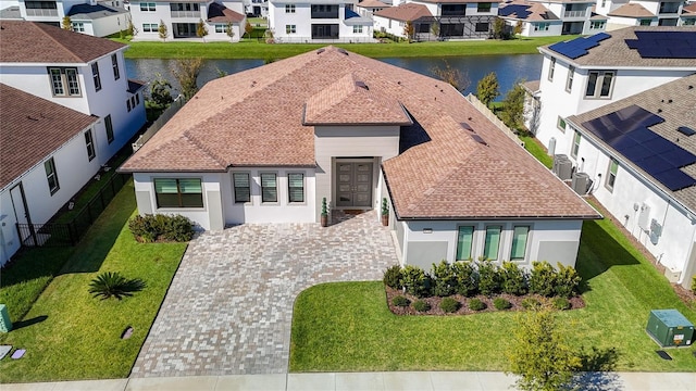 birds eye view of property featuring a water view