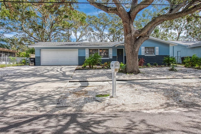 single story home featuring a garage