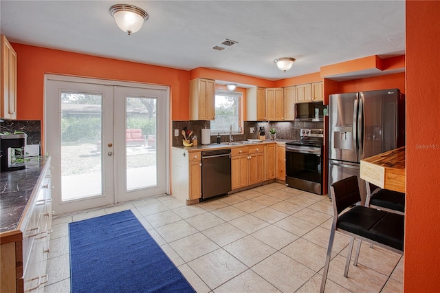 kitchen featuring french doors, sink, light brown cabinetry, tasteful backsplash, and stainless steel appliances