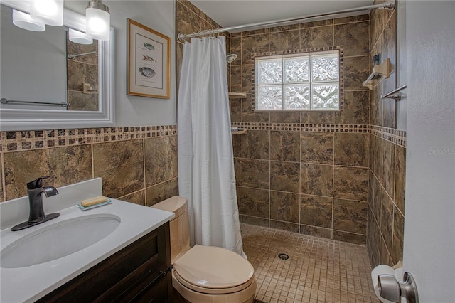 bathroom featuring walk in shower, vanity, toilet, and tile walls