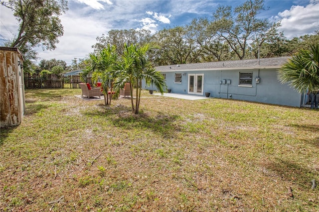 view of yard with french doors