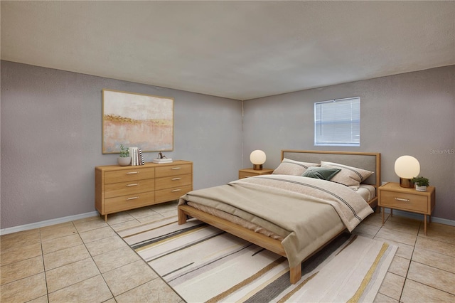 bedroom with light tile patterned floors