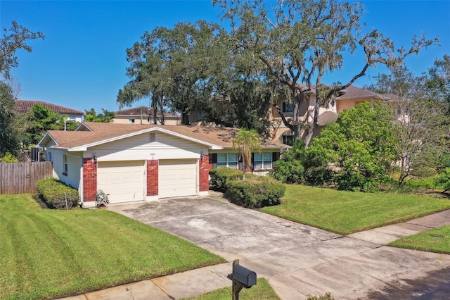 single story home featuring a front lawn and a garage