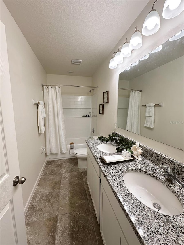 full bathroom featuring vanity, shower / bath combo, a textured ceiling, and toilet