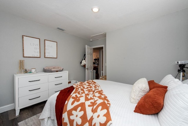 bedroom featuring dark hardwood / wood-style flooring