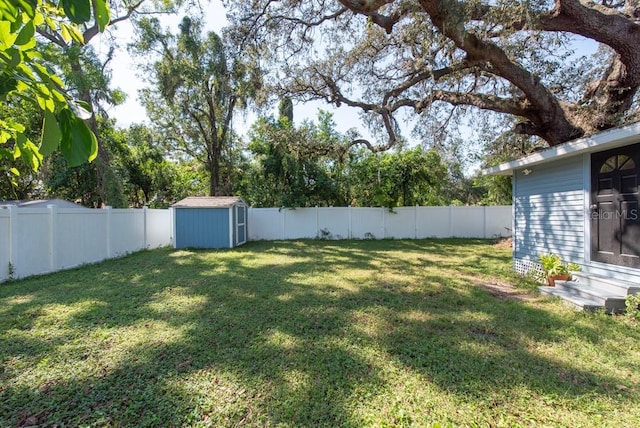 view of yard with a storage unit