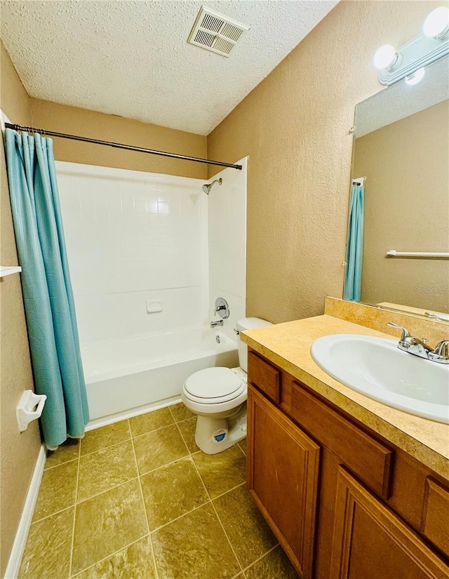 full bathroom featuring toilet, a textured ceiling, vanity, and shower / bathtub combination with curtain