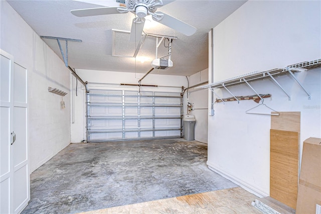 garage featuring ceiling fan and a garage door opener