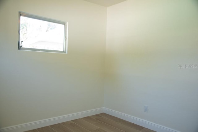 spare room featuring light hardwood / wood-style flooring