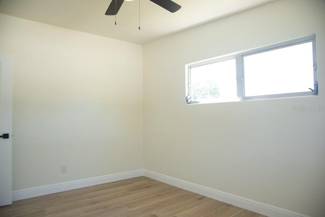 unfurnished room with light wood-type flooring and ceiling fan