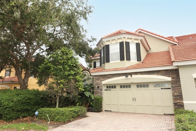 view of front of property with a garage