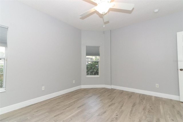 unfurnished room with ceiling fan and light hardwood / wood-style flooring