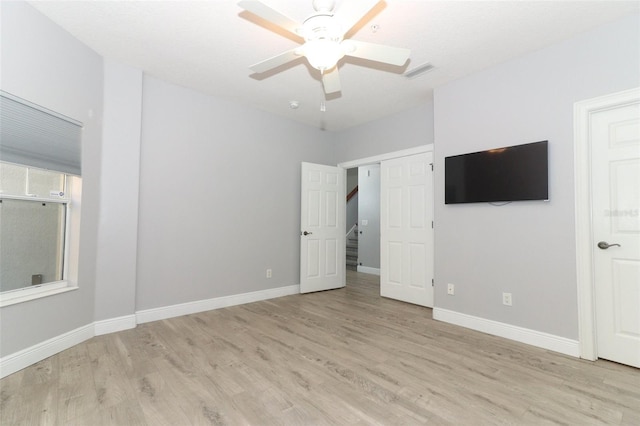 unfurnished bedroom featuring ceiling fan and light hardwood / wood-style flooring