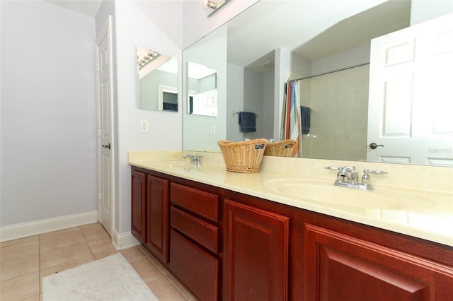 bathroom featuring tile patterned floors, vanity, and a shower with curtain