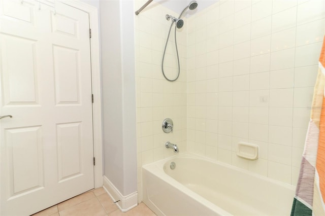 bathroom with tile patterned flooring and shower / bath combo